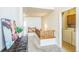 Light-filled hallway with wood railing and view of the laundry room at 1404 Tonkin Pl, Longmont, CO 80504