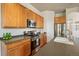 Well-equipped kitchen featuring stainless steel appliances, ample cabinet space, and sleek countertops at 1404 Tonkin Pl, Longmont, CO 80504