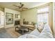 Cozy living room with a fireplace, built-in shelving, and a comfortable sofa at 1404 Tonkin Pl, Longmont, CO 80504