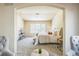 Bright and airy main bedroom featuring ample natural light, a comfortable bed, and tasteful decor at 1404 Tonkin Pl, Longmont, CO 80504