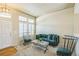 Inviting sitting room with a stylish sofa, a modern coffee table, and ample natural light at 1404 Tonkin Pl, Longmont, CO 80504