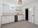 Basement with stylish cabinetry, shelving, a beverage refrigerator, carpet, and a door to a wine cellar at 280 Ammons St, Lakewood, CO 80226