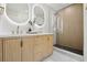 Modern bathroom with double sinks, vanity, walk-in shower, and stylish lighting at 280 Ammons St, Lakewood, CO 80226
