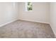 Bedroom in the basement featuring neutral carpet and great natural light at 280 Ammons St, Lakewood, CO 80226