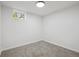 Bedroom in the basement featuring neutral carpet and great natural light at 280 Ammons St, Lakewood, CO 80226