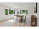 Bright dining room featuring a wooden table with seating, a bench, and lots of natural light at 280 Ammons St, Lakewood, CO 80226