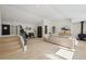 Bright living room with hardwood floors, modern staircase, and neutral decor at 280 Ammons St, Lakewood, CO 80226