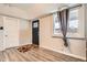 Welcoming entryway with decorative rugs and natural light from the window at 3930 W Kentucky Ave, Denver, CO 80219