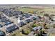 An aerial view shows modern homes with well-maintained lawns and sidewalks in a Primary-planned community at 655 Stonebridge Dr, Longmont, CO 80503