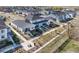 An aerial view showcases modern homes with well-maintained lawns and sidewalks in a Primary-planned community at 655 Stonebridge Dr, Longmont, CO 80503