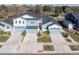 An aerial view of houses, showcasing their exteriors, driveways, and well-manicured landscaping at 655 Stonebridge Dr, Longmont, CO 80503