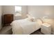 Cozy bedroom with neutral walls, plush carpet, a window, and classic furniture at 655 Stonebridge Dr, Longmont, CO 80503