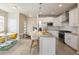 Well-lit kitchen featuring stainless steel appliances and island with pendant lights and barstool seating at 655 Stonebridge Dr, Longmont, CO 80503