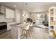Bright, modern kitchen with stainless steel appliances and a large island with bar seating at 655 Stonebridge Dr, Longmont, CO 80503