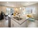 Open-concept kitchen and living area with stainless steel appliances and a cozy dining space at 655 Stonebridge Dr, Longmont, CO 80503