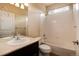 This bathroom features a shower-tub combo, a vanity and a toilet at 27235 E Lakeview Pl, Aurora, CO 80016