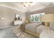 Inviting main bedroom with tray ceiling, neutral tones, and large window with backyard view at 27235 E Lakeview Pl, Aurora, CO 80016