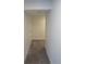 Hallway with neutral carpet and white paint leading to other rooms at 25858 E Bayaud Ave, Aurora, CO 80018