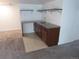 Basement wet bar with granite countertop, sink, and cabinetry at 25858 E Bayaud Ave, Aurora, CO 80018