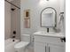 Modern bathroom showcasing a bathtub with stylish shower, sleek fixtures, and elegant tile, creating a relaxing space at 4020 Upham St, Wheat Ridge, CO 80033