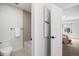 Charming bathroom offers bathtub with stylish tile, and the view of a bedroom, creating a serene and functional space at 4020 Upham St, Wheat Ridge, CO 80033