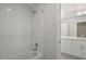 Bathroom featuring a shower and tub combo with subway tile and a modern vanity at 4020 Upham St, Wheat Ridge, CO 80033