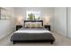 Cozy bedroom featuring a plush bed with stylish pillows and bedside lamps at 4020 Upham St, Wheat Ridge, CO 80033