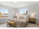 Bright bedroom featuring a comfortable bed, matching nightstands, and ample natural light at 4020 Upham St, Wheat Ridge, CO 80033