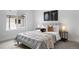 Inviting bedroom featuring a large window, neutral decor, and modern side tables at 4020 Upham St, Wheat Ridge, CO 80033