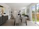 Dining and living room, featuring view to the fenced backyard at 4020 Upham St, Wheat Ridge, CO 80033