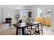 Dining room next to living room offering lots of natural light, hardwood floors, and access to the backyard at 4020 Upham St, Wheat Ridge, CO 80033