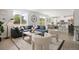 Bright and airy living room with a blue sectional sofa, modern furnishings, and light wood floors at 4020 Upham St, Wheat Ridge, CO 80033
