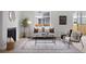 Bright living room with hardwood floors, fireplace, neutral furniture, and a view of the backyard at 4020 Upham St, Wheat Ridge, CO 80033