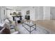 Inviting living area with modern decor, stylish furniture, and an open layout to the kitchen at 4020 Upham St, Wheat Ridge, CO 80033