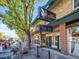 Charming exterior of 'Wolf + Wildflower' wine bar, featuring outdoor seating and an inviting storefront at 4020 Upham St, Wheat Ridge, CO 80033