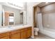 Bathroom features a double sink vanity and a shower-tub combo at 13744 Columbine St, Thornton, CO 80602