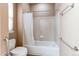 Bright bathroom featuring a shower-tub combination with a shower curtain, and white tile at 13744 Columbine St, Thornton, CO 80602