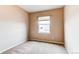 Bedroom with a window, natural light, and carpeted floors at 13744 Columbine St, Thornton, CO 80602