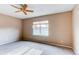 Bright bedroom with neutral walls, a ceiling fan, and a window with natural light at 13744 Columbine St, Thornton, CO 80602