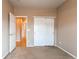 Bedroom with ample space, carpeting, closet and view to hallway at 13744 Columbine St, Thornton, CO 80602