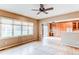 Bright dining area with hardwood floors, a sliding glass door to the backyard, and adjacent built-in cabinets at 13744 Columbine St, Thornton, CO 80602