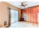 Dining area featuring hardwood floors, sliding door access to the backyard, and built-in wood cabinets at 13744 Columbine St, Thornton, CO 80602
