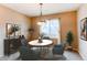 Inviting dining area with an oval table set beneath an elegant chandelier at 13744 Columbine St, Thornton, CO 80602