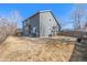 Large backyard showcasing the home's exterior and patio area at 291 Las Lomas St, Brighton, CO 80601