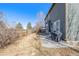 View of the backyard featuring a concrete patio and wood fence at 291 Las Lomas St, Brighton, CO 80601