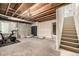 Unfinished basement featuring carpeting and a stairway to upper floors at 291 Las Lomas St, Brighton, CO 80601