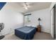 Simple bedroom featuring neutral carpet, a ceiling fan, a bed, and a window at 291 Las Lomas St, Brighton, CO 80601