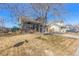 Charming two-story home with a well-manicured lawn and a two-car garage at 291 Las Lomas St, Brighton, CO 80601