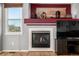 Close-up of a fireplace with a decorative mantel and a view of the exterior at 291 Las Lomas St, Brighton, CO 80601