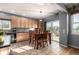 Kitchen with a dining area, stainless steel appliances, tile backsplash and floors at 291 Las Lomas St, Brighton, CO 80601